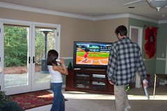 Sophia and Jon play Wii baseball