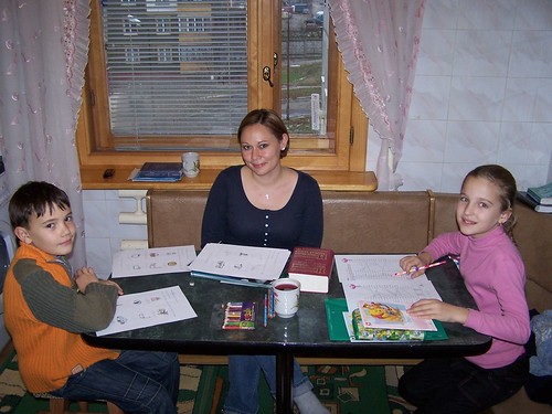 Edna teaching English to Oleg and Kristina