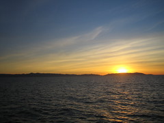 Sun setting behind the island