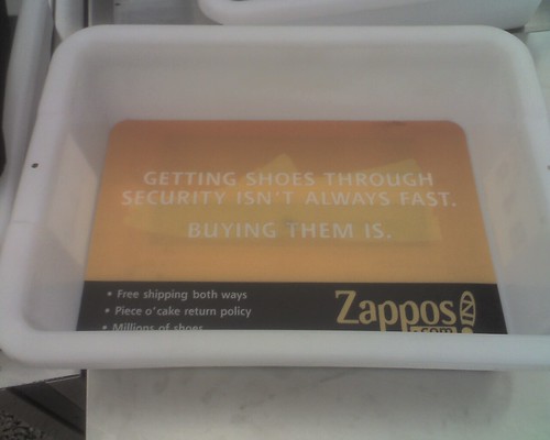 Zappos Ad in Airport Security Tub