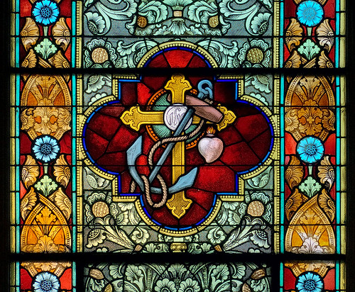 Saint Peter Roman Catholic Church, in Saint Charles, Missouri, USA - stained glass window of cross and anchor