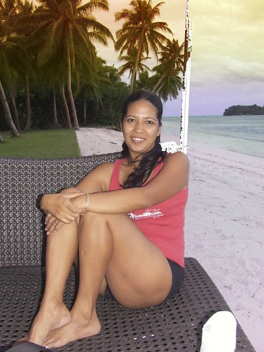 Pretty Siarigao Island Girl sitting on the beach