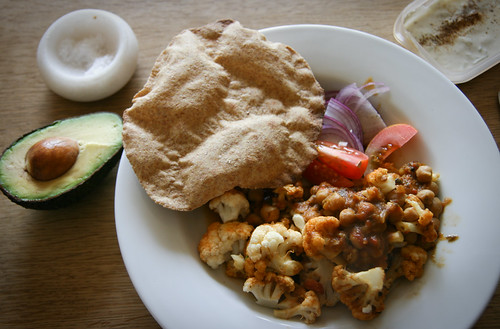 Chana masala, chapati and cauliflower with raita and avo