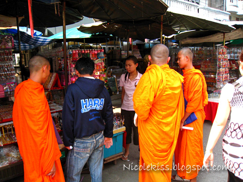 monks shopping for crinkets