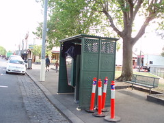 A covered Telstra phone booth