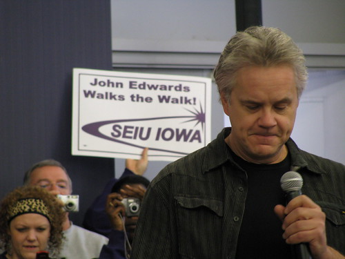 Tim Robbins reads his speech as he introduces John Edwards on Dec. 12, 2007