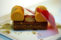 Side view of Spiced Pumpkin Mousse, Gingerbread Sponge, Crisp Cranberry