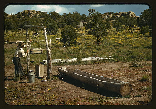 Faro Caudill drawing water from his well, Pie Town, New Mexico (LOC)