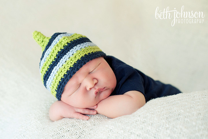 newborn baby boy with cute striped hat