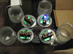 Really, there weren't many construction photos to take, but here's the garden lamp guts being epoxied to the jar lids.