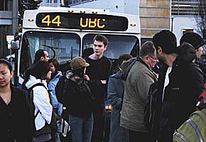 UBC students wait to board the bus