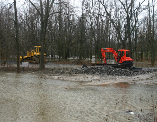 Construction Vehicles Surrounded by Water