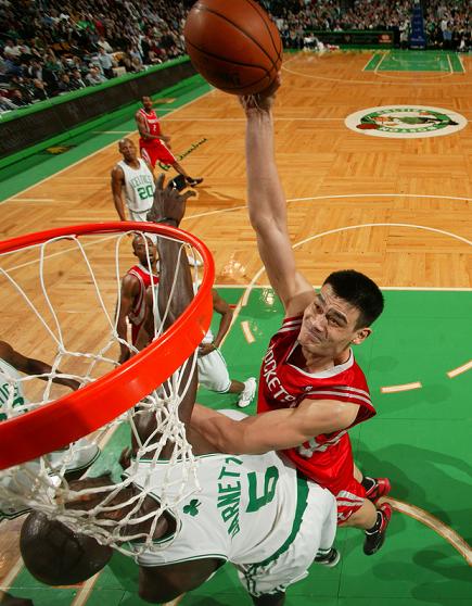 Yao Ming elevates over Boston's Kevin Garnett for a one-handed jam.  However, Garnett would get the last laugh as he willed his team to a fourth quarter victory over the surprising Rockets.