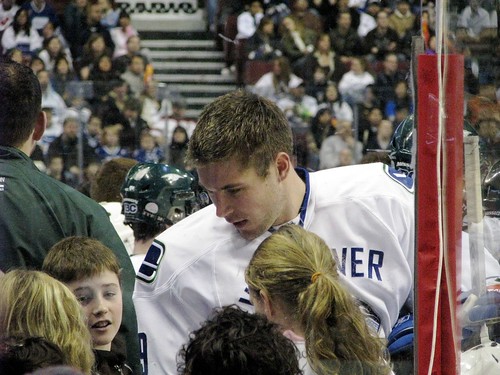 Pyatt passing on his skills with chicks to the young lad by John Bollwitt.