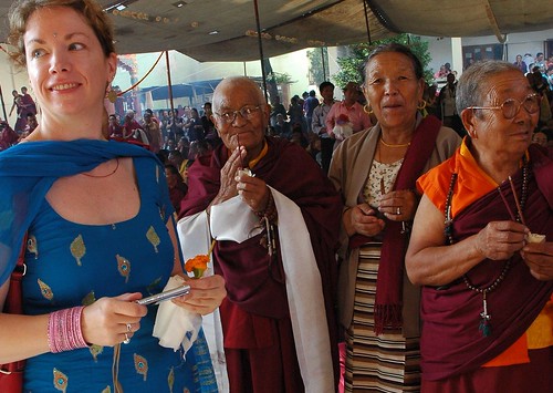 Lucinda Ritter wearing a tika, with a small camera, nuns, laypeople, and other students attending Lam Dre, Tharlam Monastery, Bodha, Kathmandu, Nepal by Wonderlane