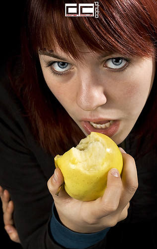 A girl eating an apple