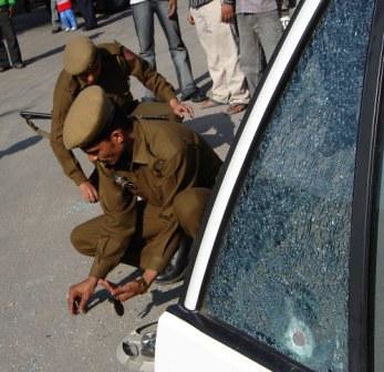SHOOT OUT AT MANDA- Damaged car window during an encounter between Police criminals near Manda in Jammu on Sunday
