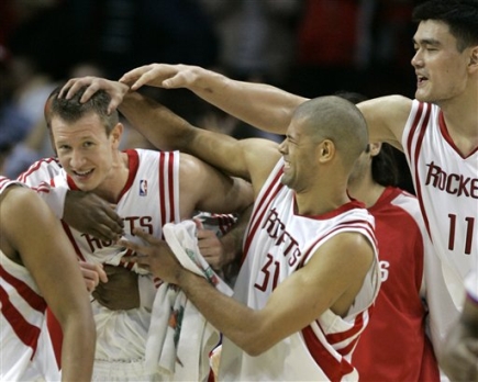 Yao Ming, Shane Battier and other Rocket teammates congratulate Steve Novak after he hit a game-winning 3-pointer to save the game for the Rockets and give them their 8th victory in a row.  Houston had blown an 18-point 4th quarter lead before Novak's shot.  Yao led all Houston scorers with 25 points and 14 rebounds.