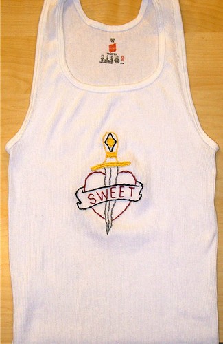 hand embroidered retro tatoo design on a men's wife beater undershirt tank
