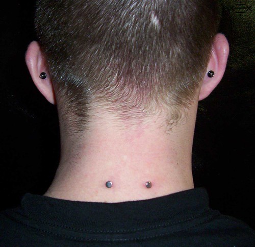 12g 1" nape and 8g conch piercings by Aestheticsbodymod
