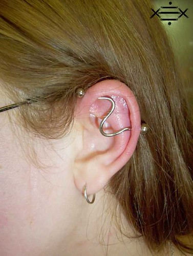 spiral industrial piercing. 14g curved industrial piercing