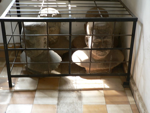 Caged busts of Pol Pot