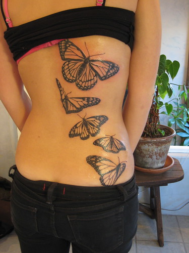 orchids tattoos. butterfly tattoo art with