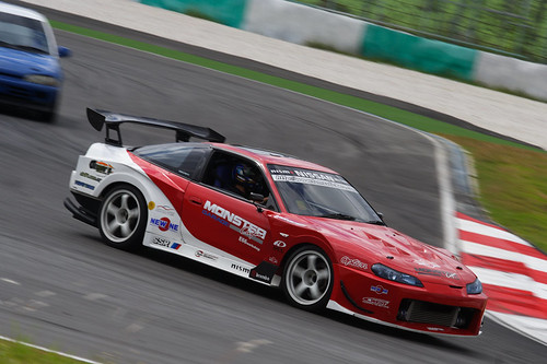 A modified Nissan Silvia tackles Turn 2 of the Sepang International Circuit