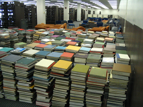 Huge stacks of books at the University of Illinois Undergraduate Library during rearranging