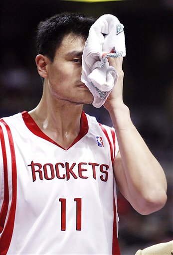 Yao Ming walks off the court in the second half of the Rockets-Detroit game after bumping into Luther Head, producing a cut above his eye that required four stitches.  Yao would score only 12 points on 4-of-13 shooting in 26 minutes of action.