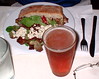 Brad's dinner - leg of lamb sandwich, a side salad with blue cheese crumbles, & a Fat Tire beer