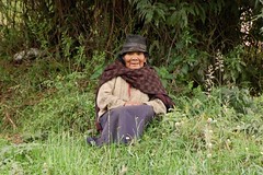 An indigenous woman resting in the shade