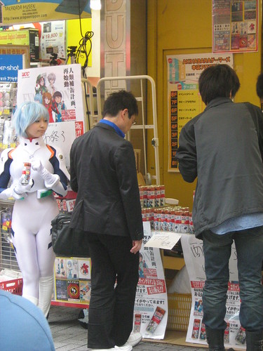 A customer buying coffee from Rei Ayanami cosplayer