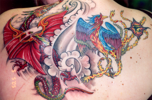 Dragon Phoenix Tattoo by Tres Denk. Tattoo by Tres Denk