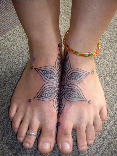 flower foot tattoos Foot tattoos are more painful