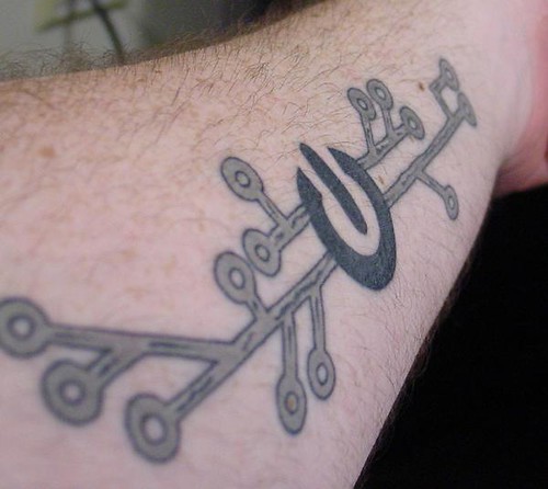 Power symbol and circuit trace tattoo