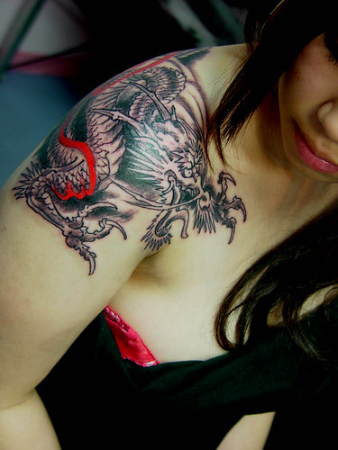 small dragon tattoo. tattoo dragon