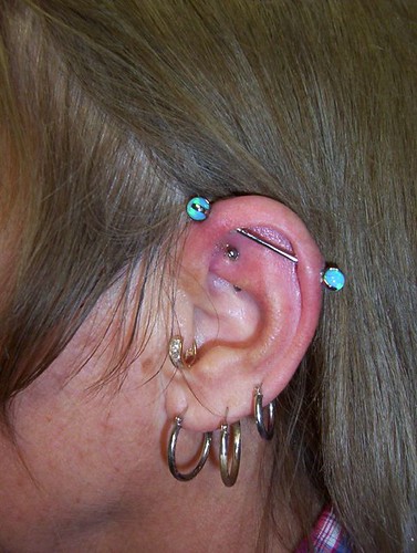 spiral industrial piercing. 14g industrial piercing by