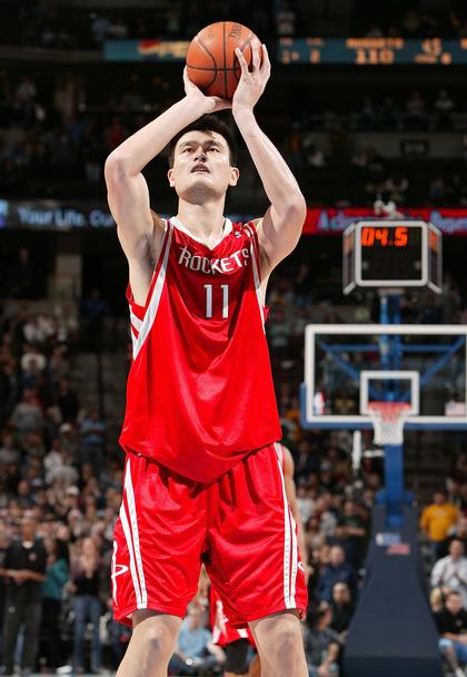 Yao Ming calmly shoots a second free throw that gives the Rockets a one-point lead in double-overtime against the Denver Nuggets, but the Rockets lost the game a couple of minutes later on a last second shot by Denver's Anthony Carter.  Yao was a force in the game, showing leadership, and scoring 26 points and grabbing 19 boards in 52 minutes of play.