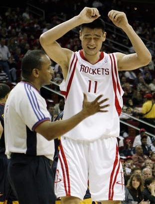 Yao Ming pleads his case to referee Eddie Rush during the Rockets-Warriors game in Houston on New Year's Eve.  Yao had some very questionable calls that got him into foul trouble and limiting his minutes.  Without him playing a full game, the Rockets made a game of it, but they couldn't hold on to a third quarter 11-point lead and lost 112-95.