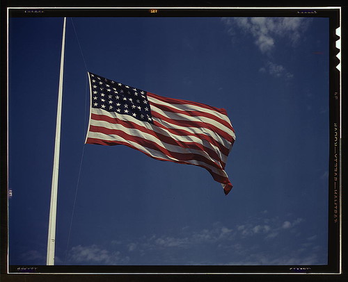 High above, over a true "home of the brave," the floating folds of the Star Spangled Banner symbolize the American way of life to soldiers in training for the battles that will bring freedom to an unhappy, wartorn world, Fort Knox, Ky. (LOC)