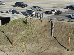 The SUV thief drove down this embankment. (Photo courtesy of The Orange County Register)