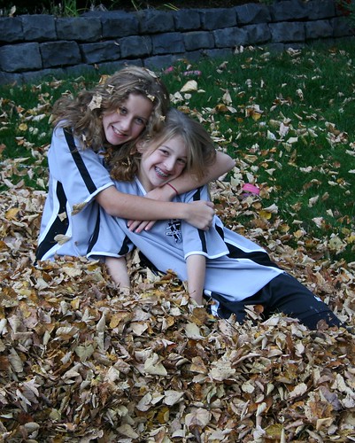 Mali and Rochelle in their leaf pile