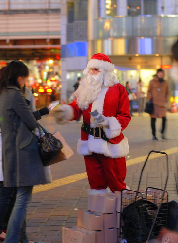 Santa giving out evangelistic Christmas carols at Shibuya Crossing
