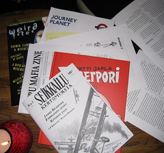 A small stack of fanzines on the table