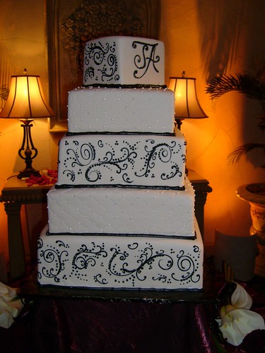 They wanted a BIG cake and got it Ivory fondant icing is decorated with 