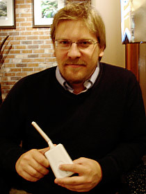 Boris Mann, of Vancouver Free the Net, holding a Meraki Mini wireless transmitter.