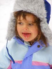 Ruby catching snowflakes on her tongue. (c) Hilltown Families