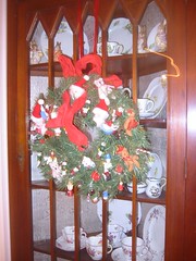 The corner cupboard in the dining room gets a wreath, too.