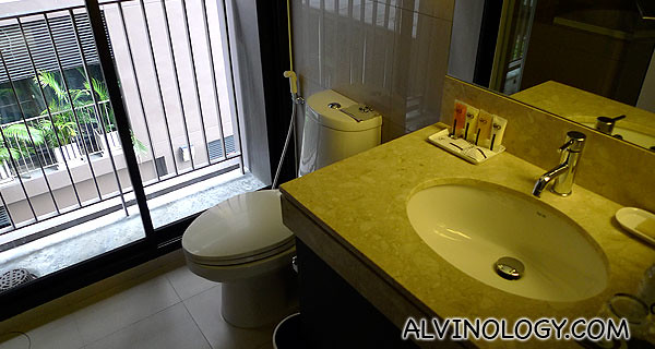 The bathroom which comes with both a bath tub and shower head